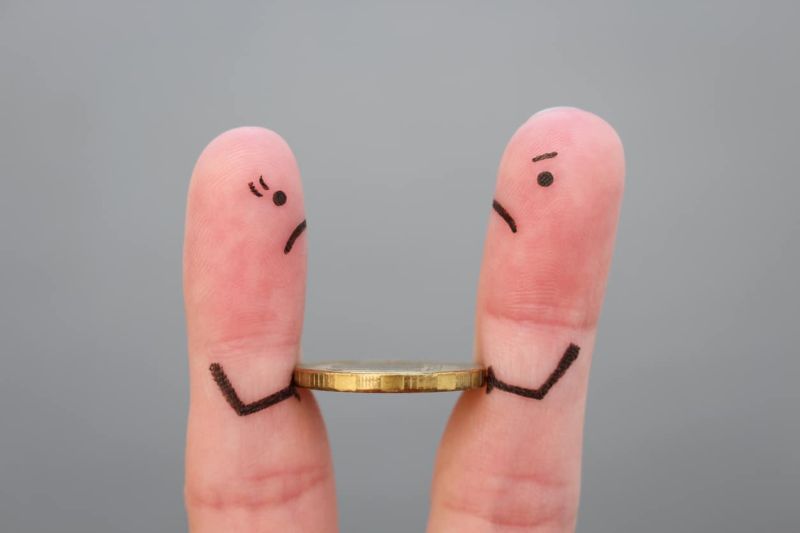 Fingers art of family during quarrel. Concept of man and woman cannot divide money after divorce.